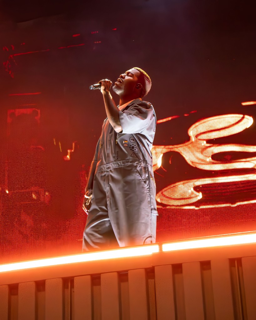 Khalid mid-song in the red wash at Moody Amphitheater.